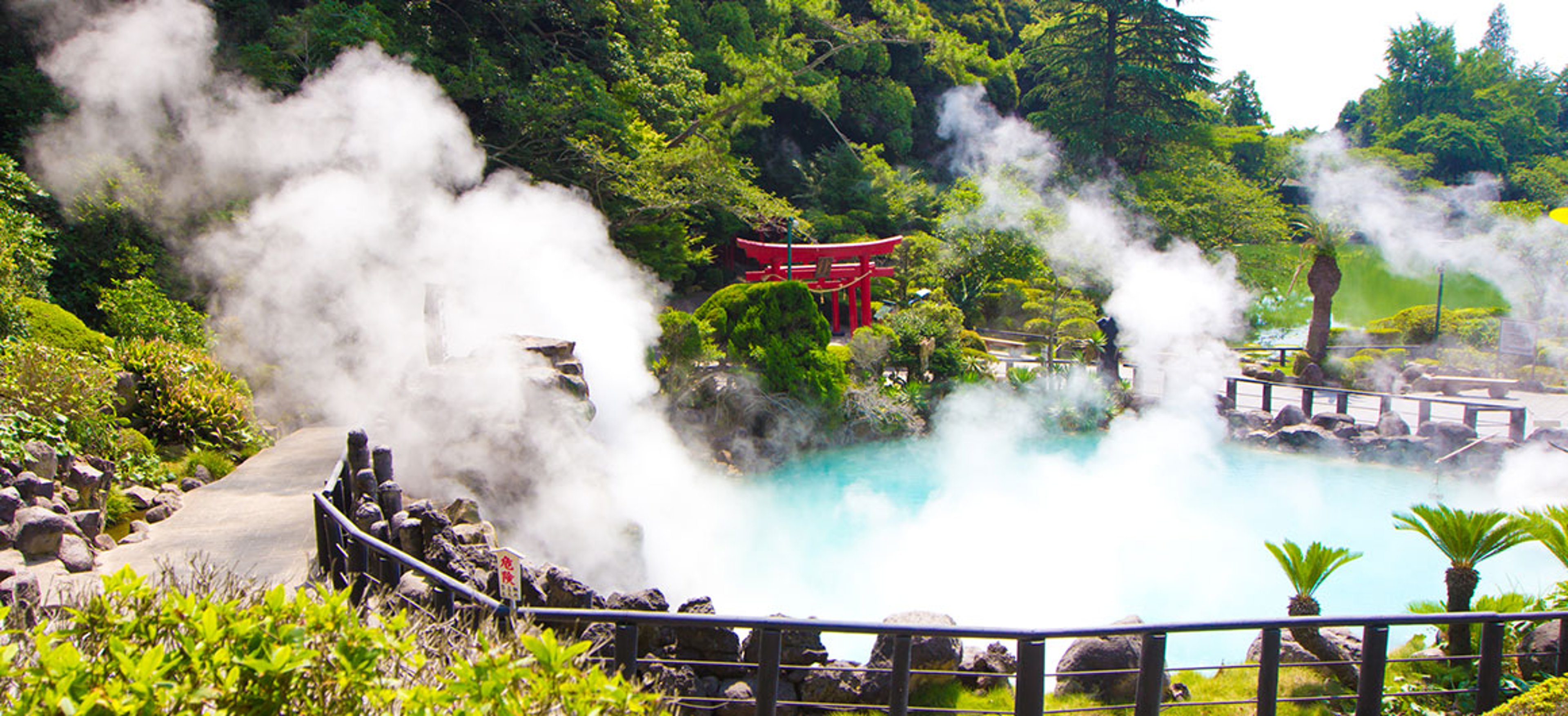 Steam rises from Umi Jigoku (Sea Hell), a geothermal hot spring in Beppu, Japan.