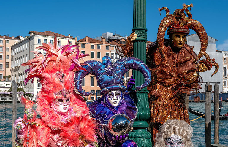 people in masquerade costumes Venice carnival