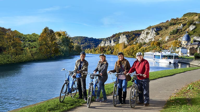 Co-Founder Kristin Karst and others enjoy cycling along the Seine River; photo courtesy of AmaWaterways