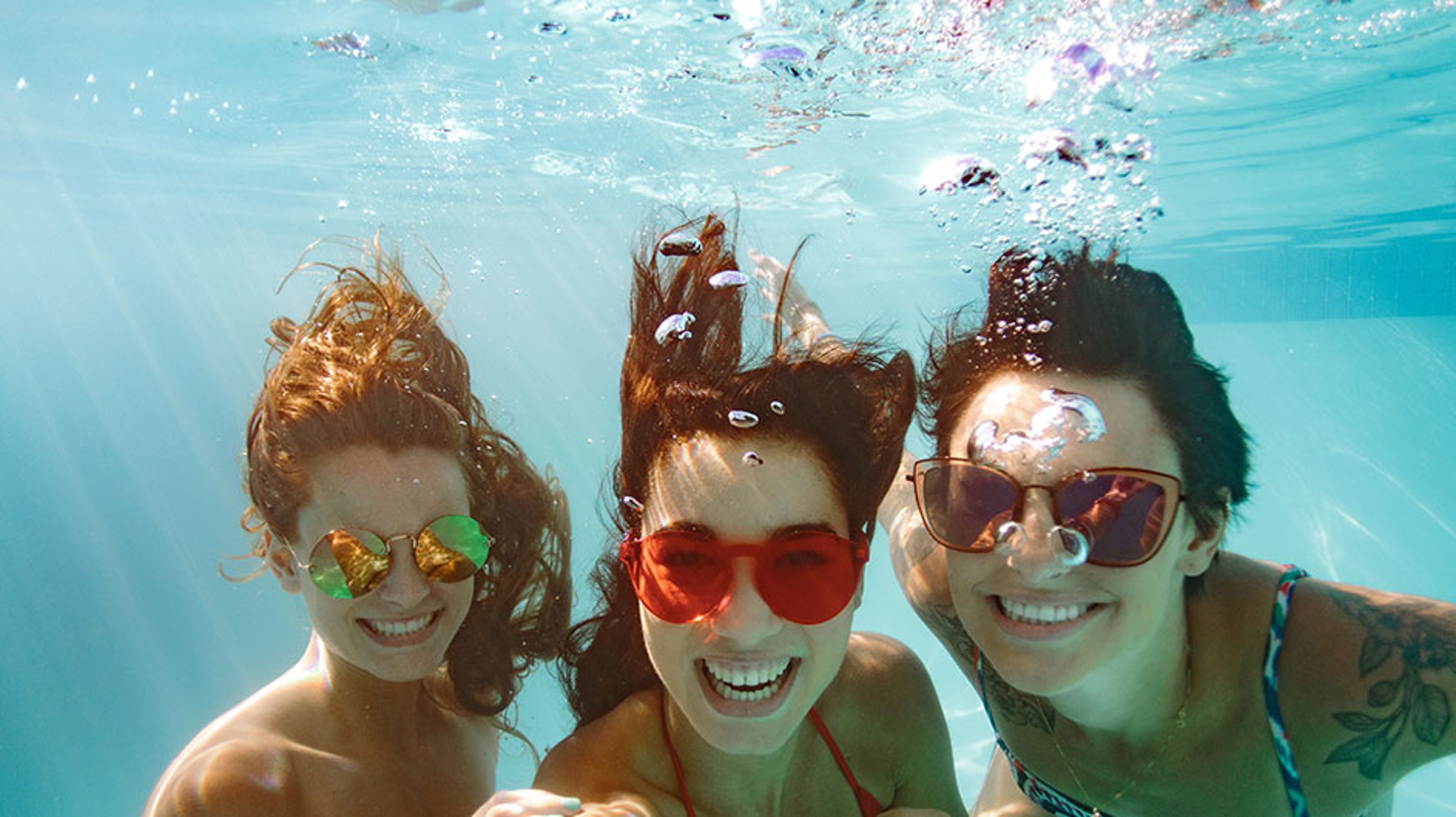 three girls underwater