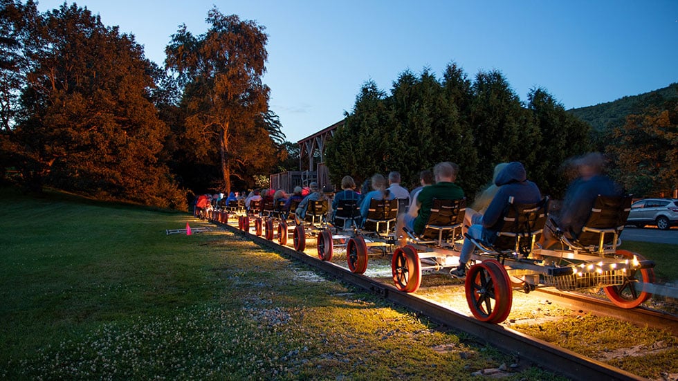 Guests pedal railbikes on a moonlight tour with Revolution Rail Co. in South Fork, Colorado.Photo courtesy of Revolution Rail Co.