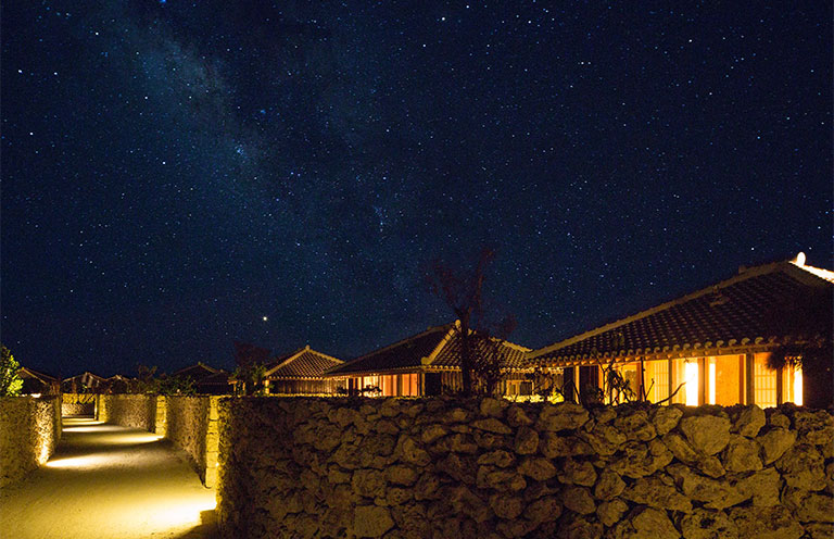 night sky with visible stars, villas shown in foreground