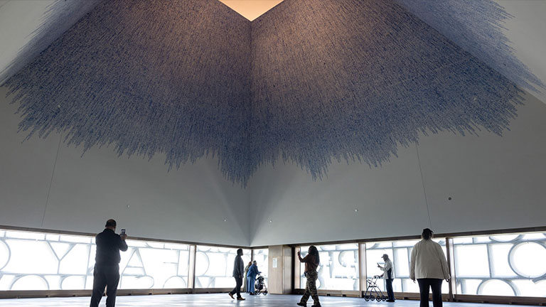 Visitors inside The Sky Room at the top of the Obama Presidential Center museum in Chicago.