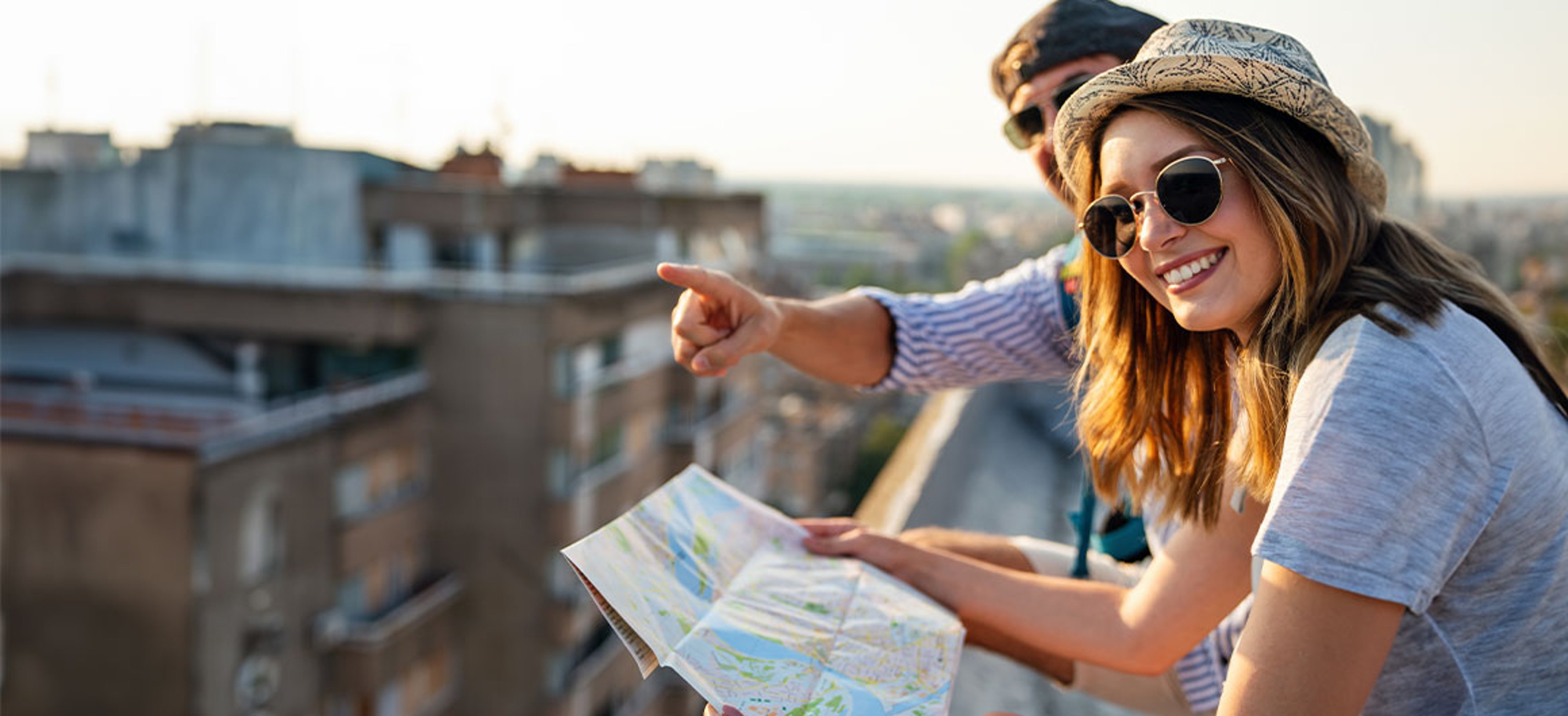 man and woman looking at map and pointing