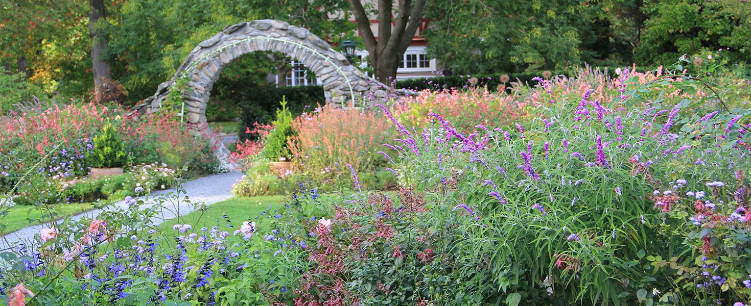 Late summer Rose Garden and Moon Gate at Blithewold Mansion, Gardens, and Arboretum