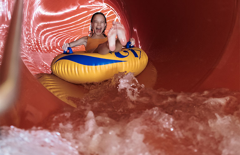 girl going down waterslide
