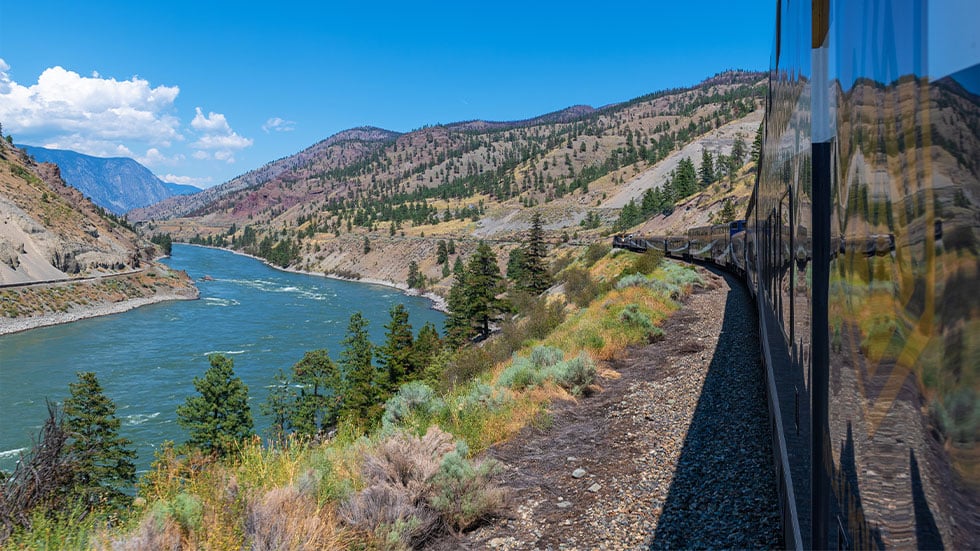 Rocky Mountaineer train along the Fraser River in British Colombia, Canada