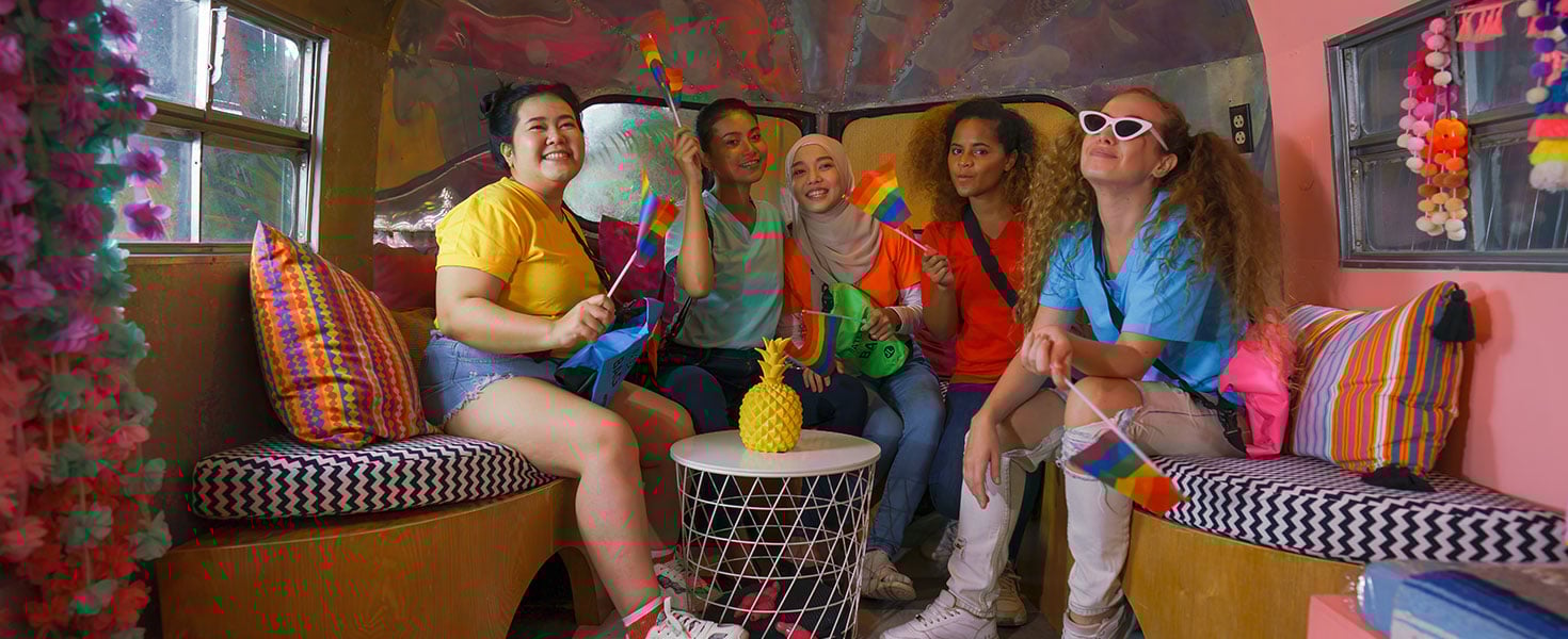 diverse multiethnic female friends get together with happiness for travel  by Mongkolchon