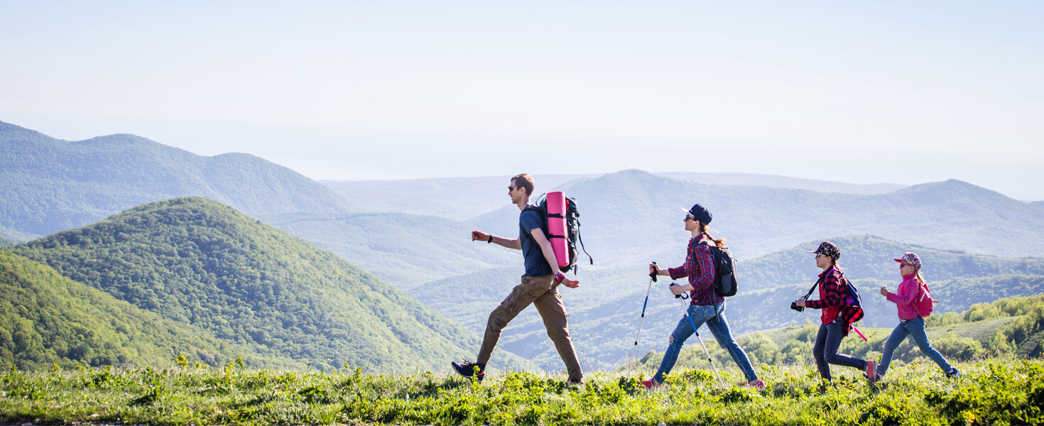 Family hiking in a line