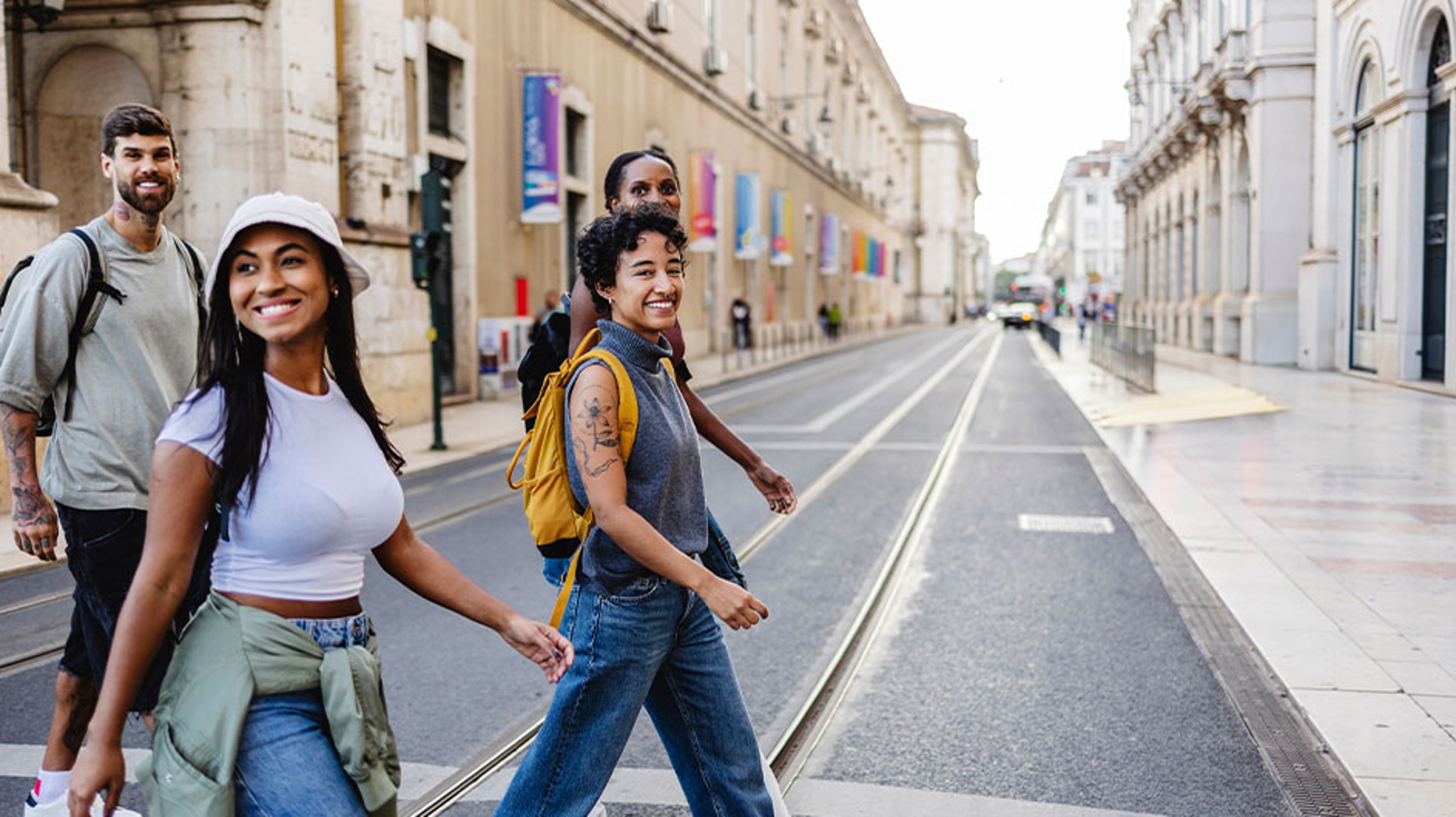  Downloaded Tourists crossing the street in lisbon city center