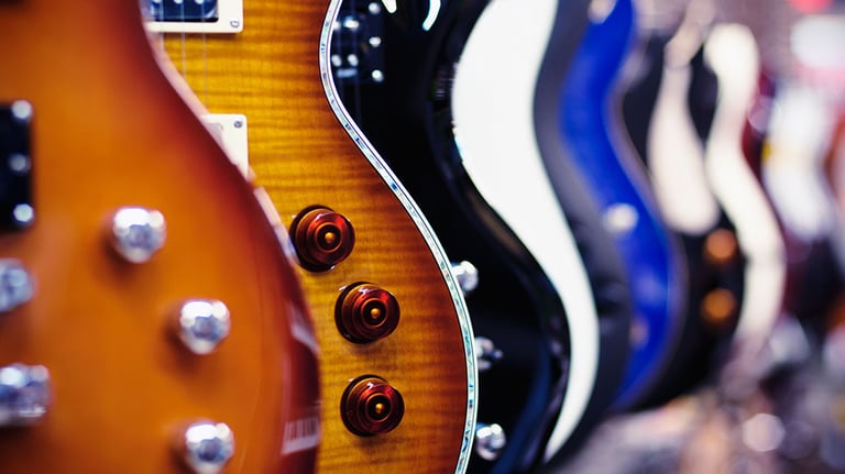 Guitars in a shop. Credit: AlexRodavlas