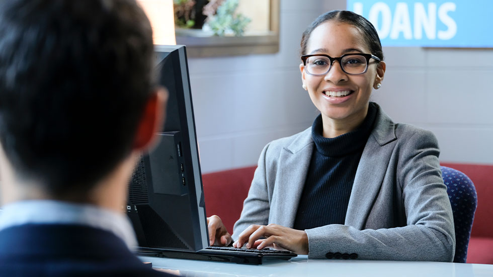 man sitting with loan officer