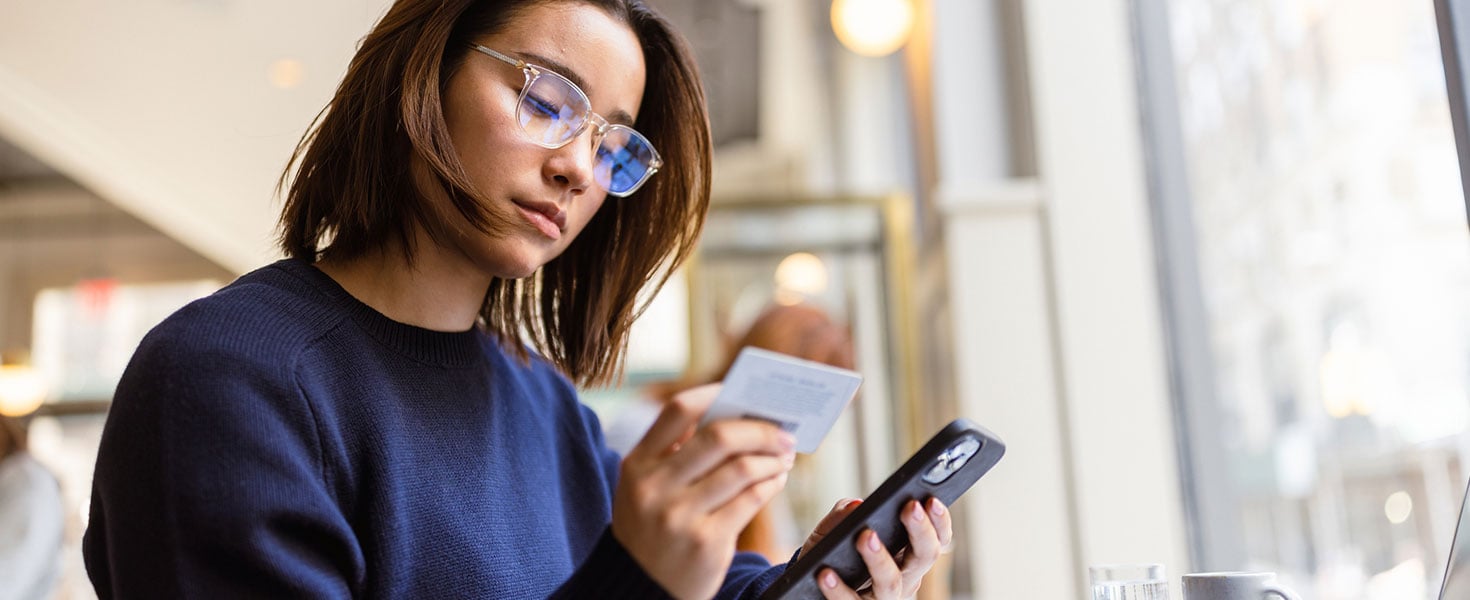 Girl looking at Credit Card