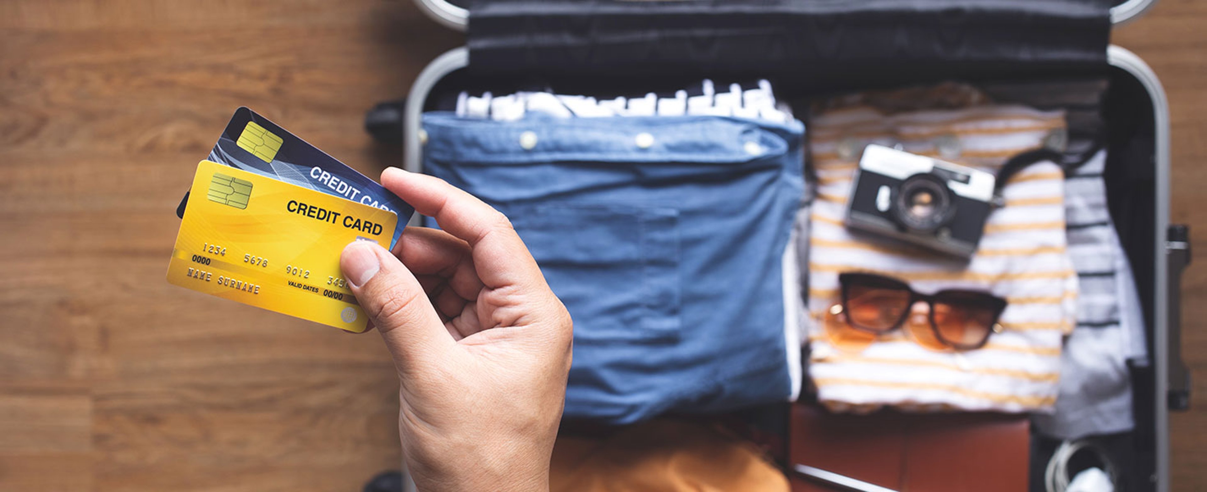 Young person using credit cards for payment on vacation or holiday trip.convenient lifestyle with technology.banking and financial. Credit: HAKINMHAN