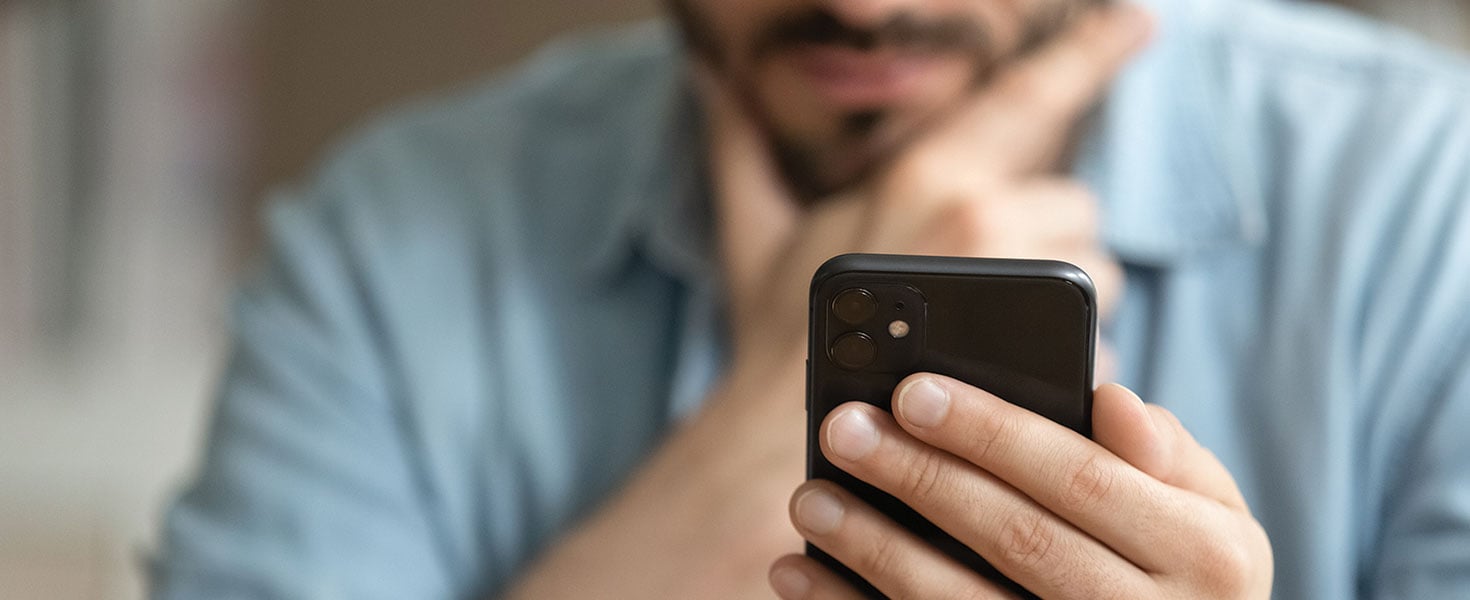  Downloaded Crop close up of man hold modern smartphone gadget look at screen text or message online. Caucasian male use cellphone browse surf wireless internet on device. Communication, technology concept. by fizkes