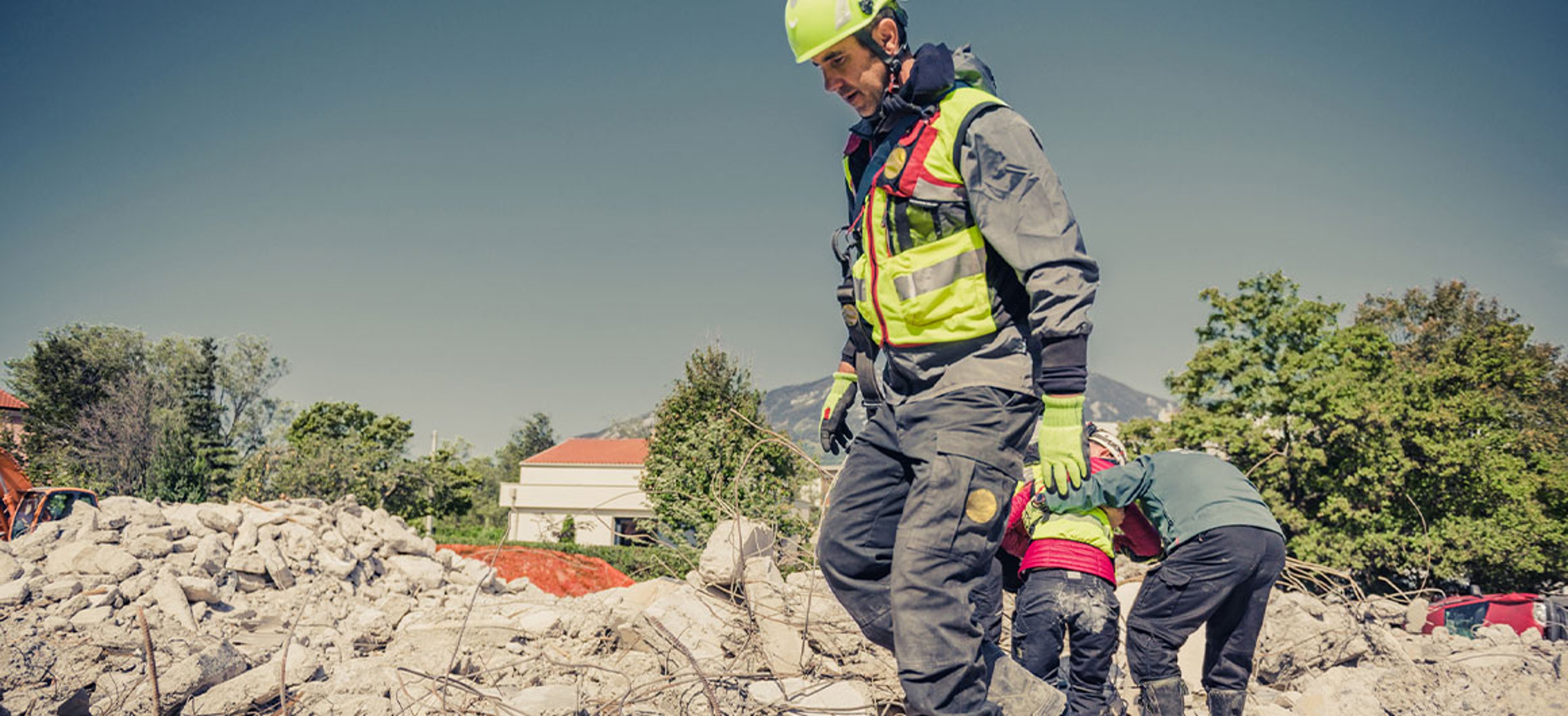 Rescuer search through ruins of building