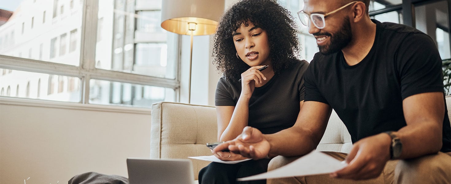 two people looking at laptop