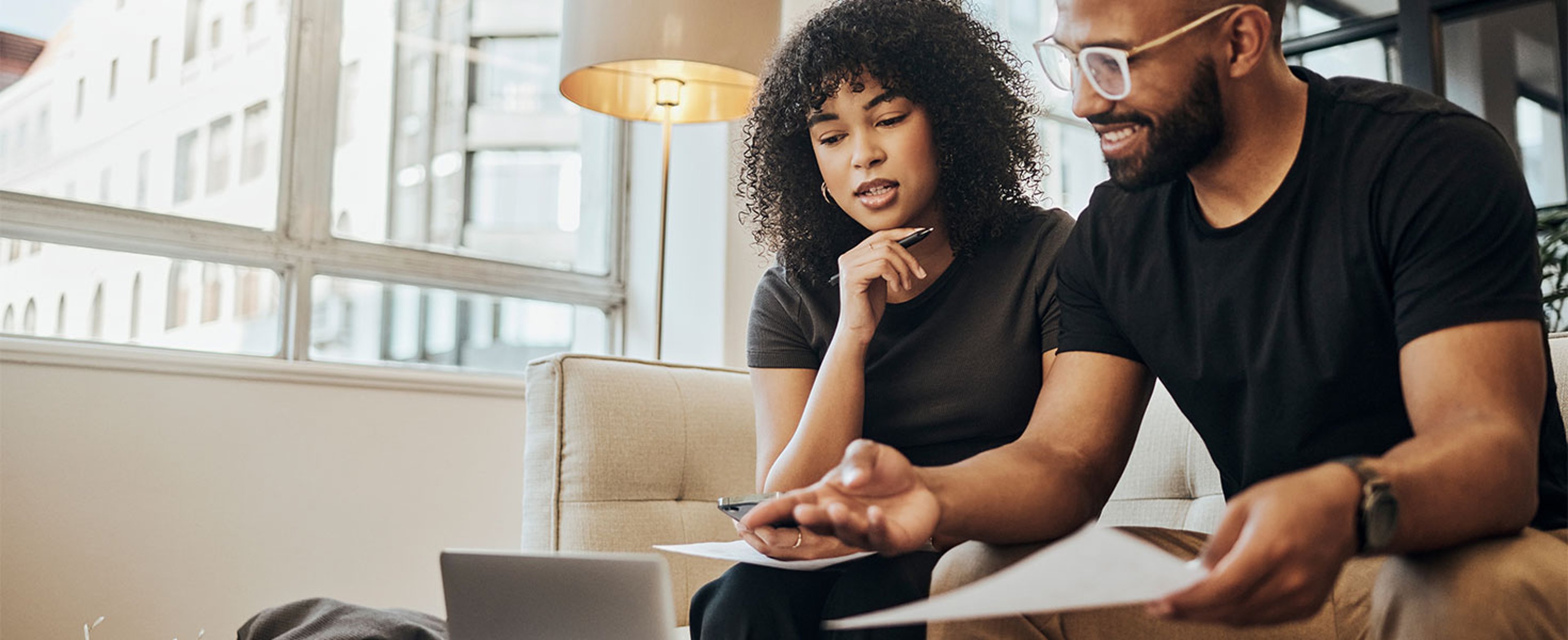 two people looking at laptop