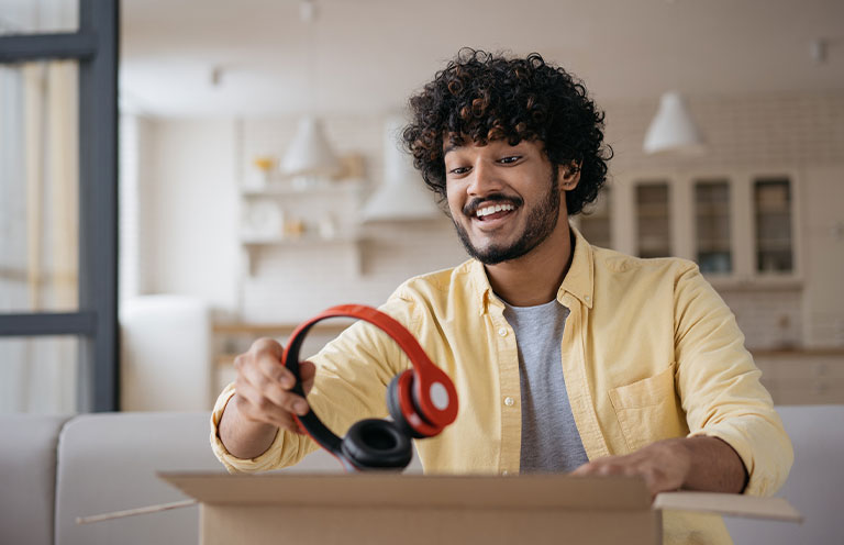 Man unboxing headphones