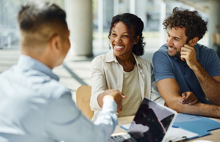 man and woman greeting agent