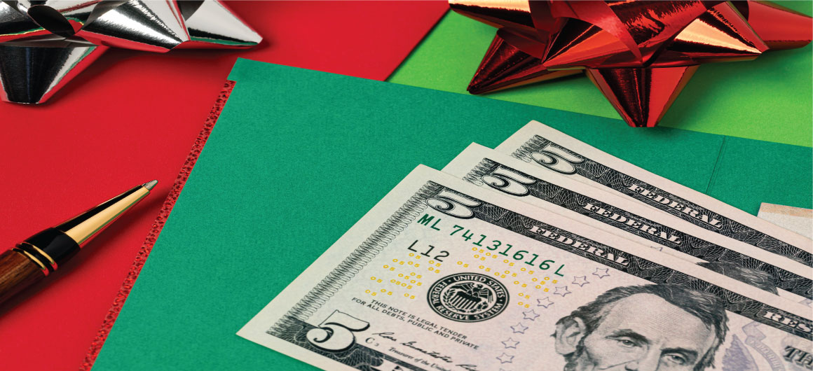 money on Christmas gift envelopes