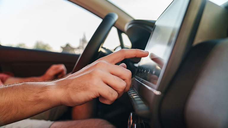 driver is touching the electronic display screen 