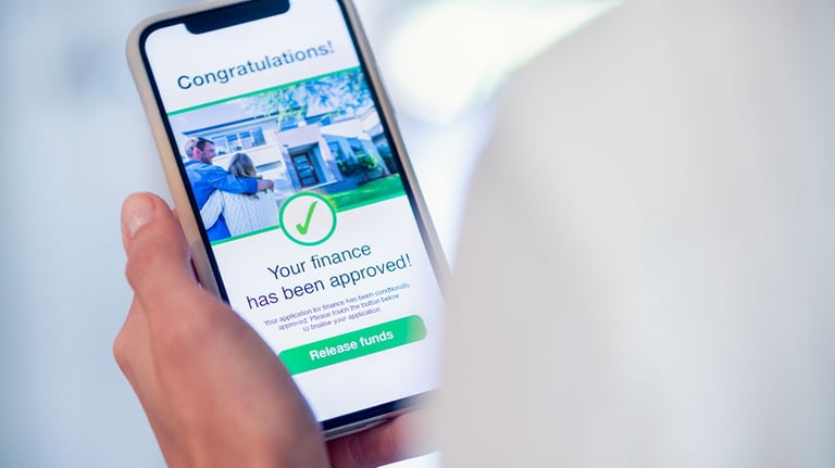 approved financial application shown on phone screen