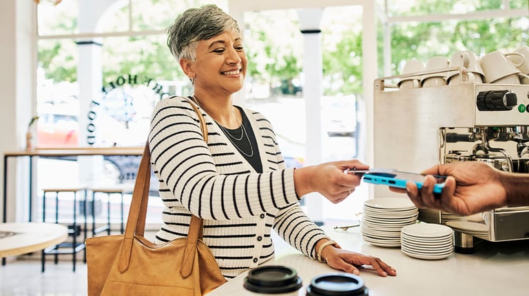 woman using card to make a purchase