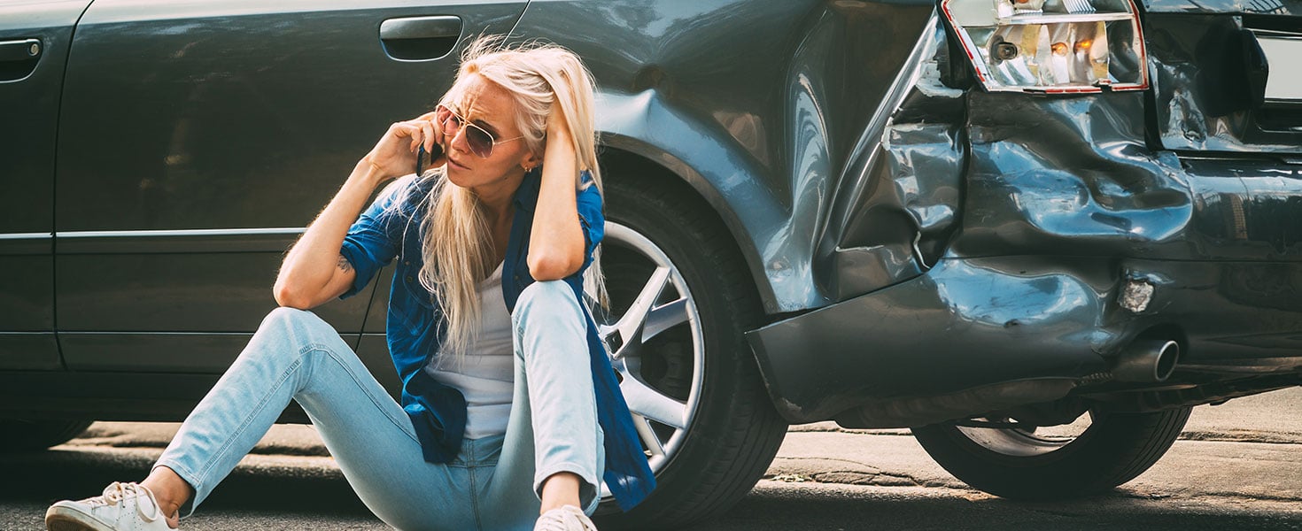 girl sits on the road, near the broken car and calls on the phone, calling for help. By indigo_nifght