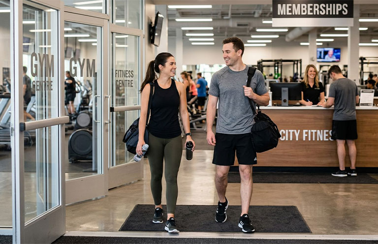 man and woman leaving the gym