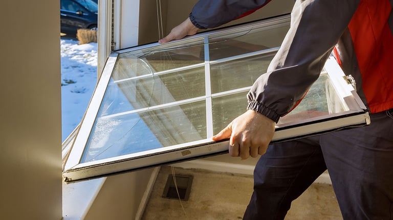 Worker in the removing break down windows in the home renovation living energy efficiency Credit:photovs