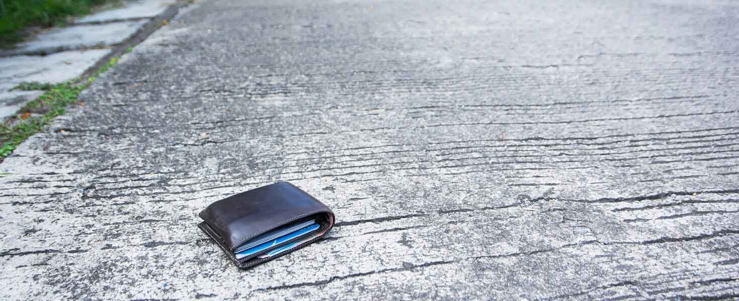 Credit card laying in the middle of the road