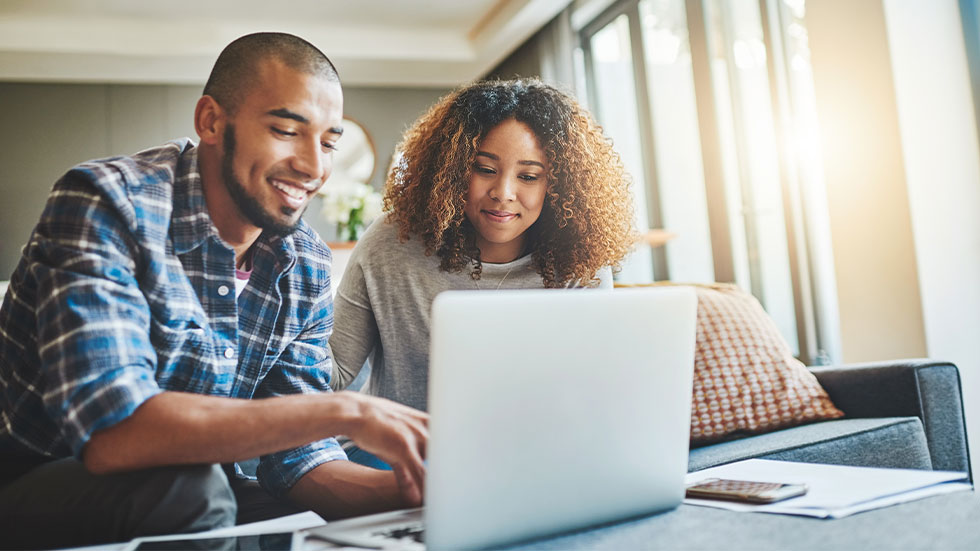 couple looking at laptop screen