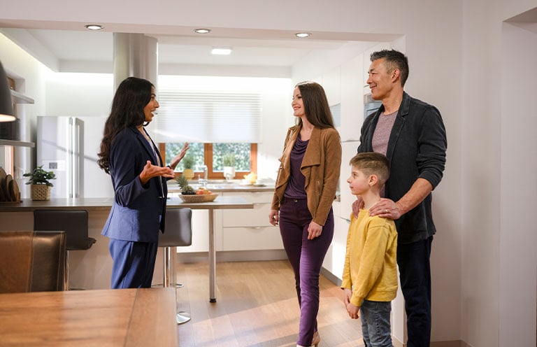 realtor talking to family about a house