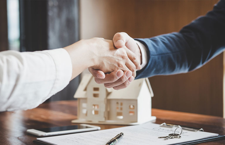 new mortgage papers, people shaking hands