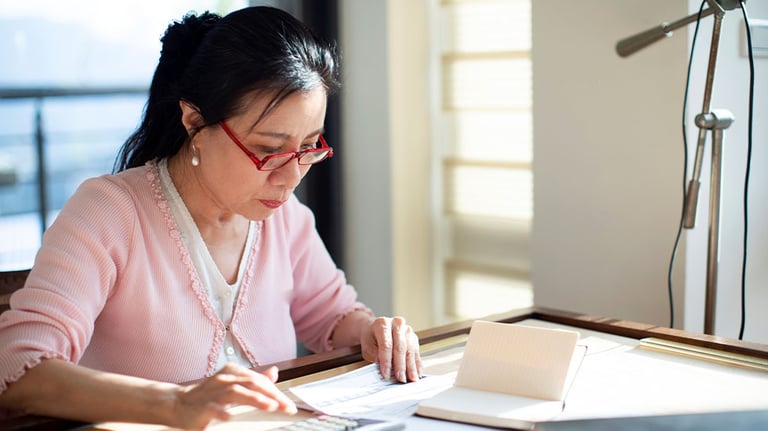 woman looking at paystub