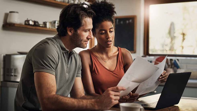 Couple reviewing accounts