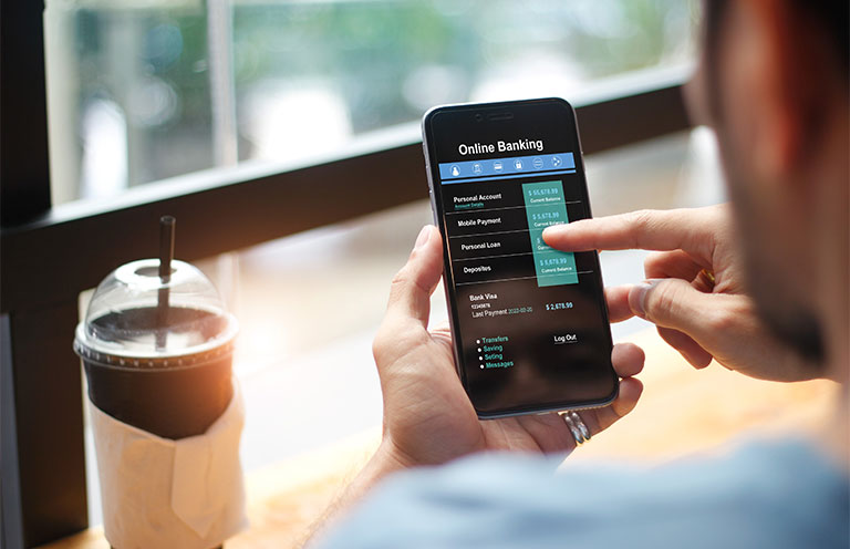 man using online banking on phone
