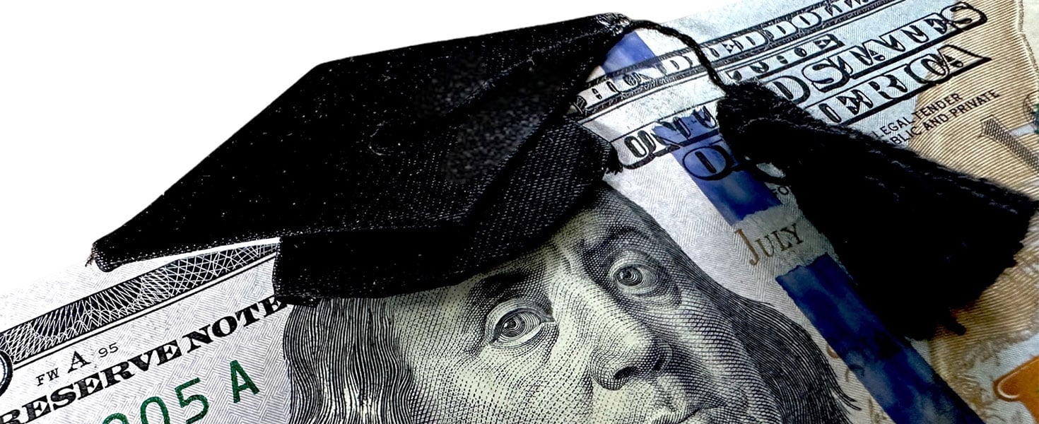 hundred dollar bill with graduation cap