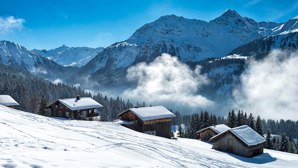 Winter landscape with ski lodge in austrian alps