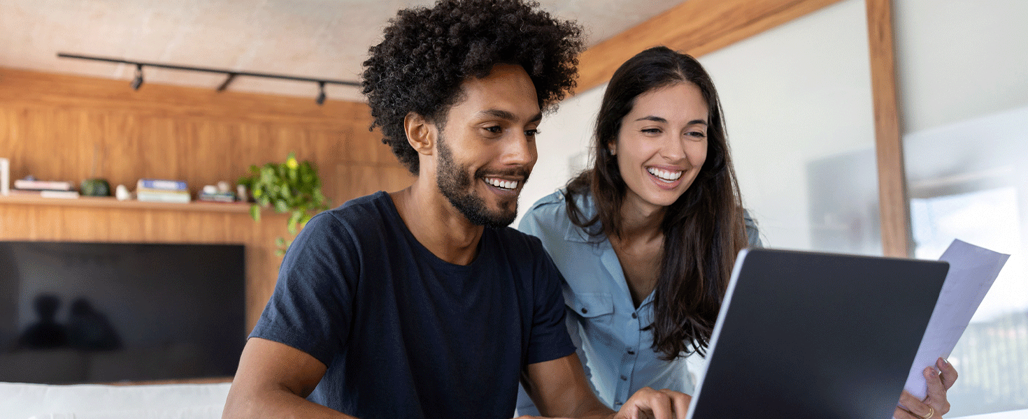 Man and woman looking at laptop