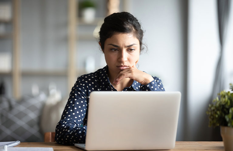 woman looking at laptop
