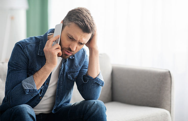 man concerned on phone