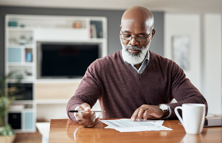 man looking at documents