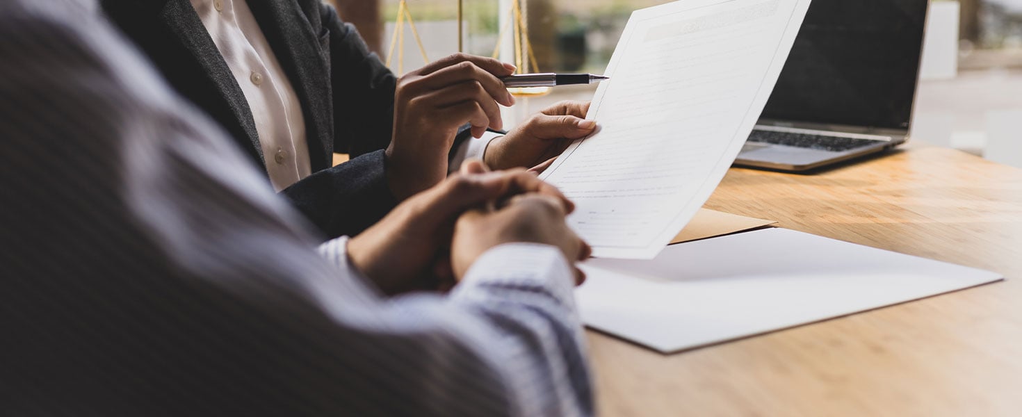 Two people looking at a document