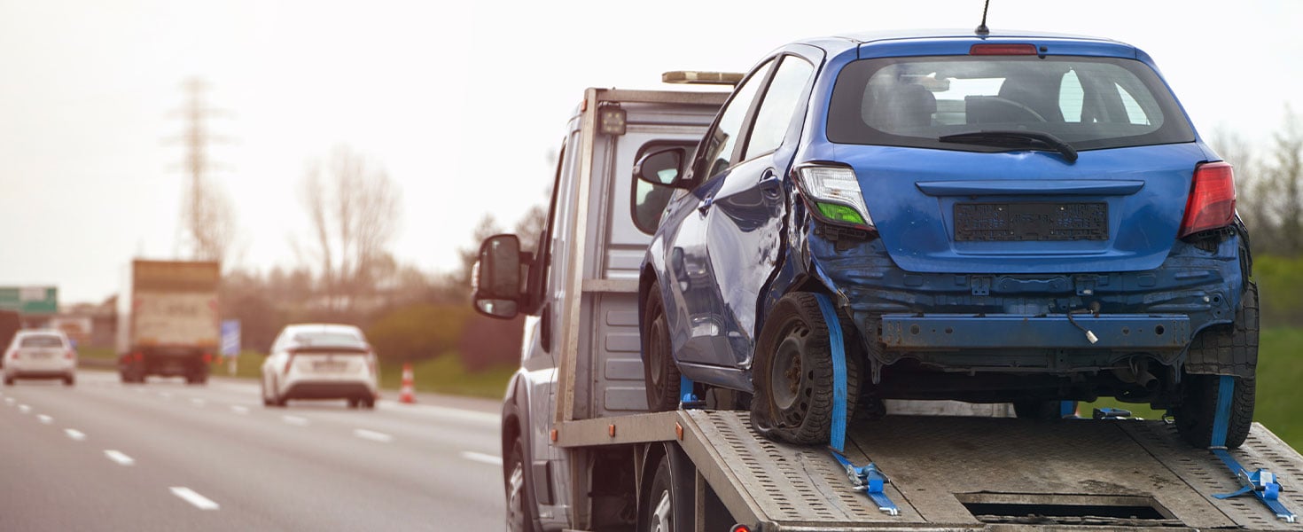 blue car being towed away