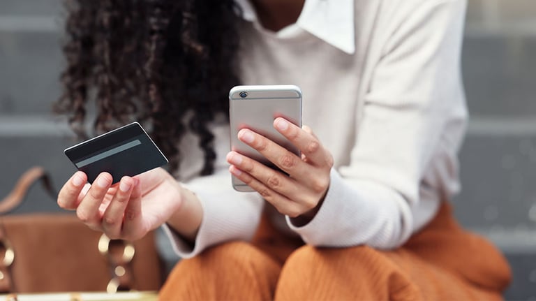Online shopping, credit card and woman on a smartphone in the city with phone and bank card in hand. Girl on internet doing shopping, ecommerce and retail purchase. Businesswoman doing online banking. Credit:PeopleImages