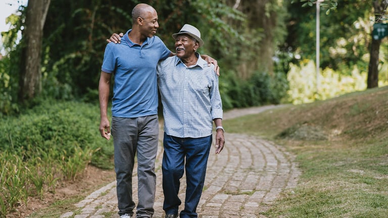 Man walking with elderly father