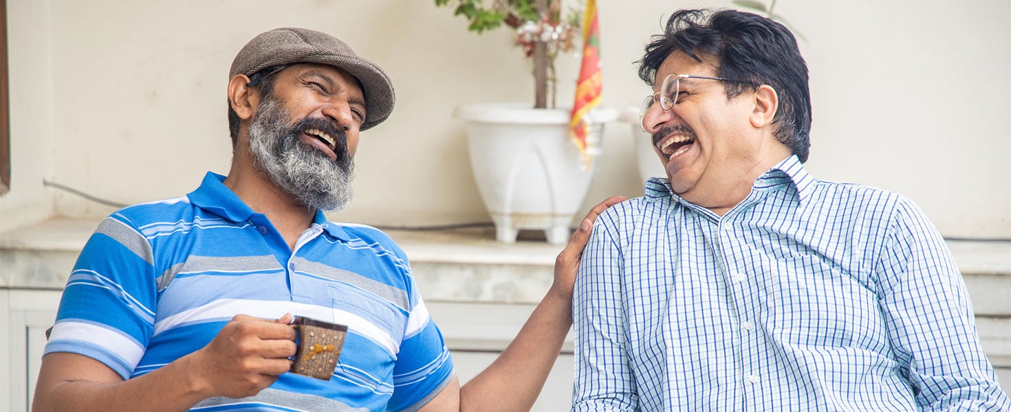 older men talking, laughing