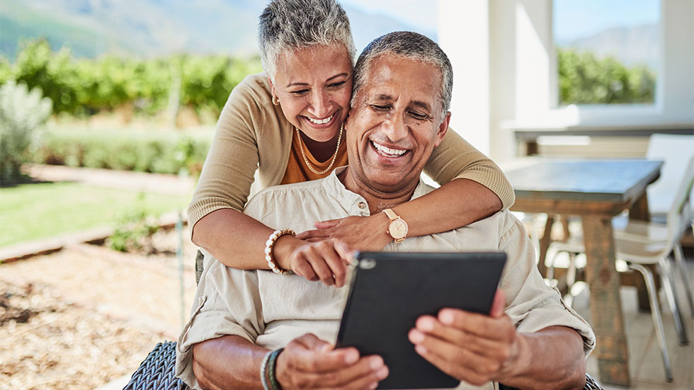 older couple looking at tablet